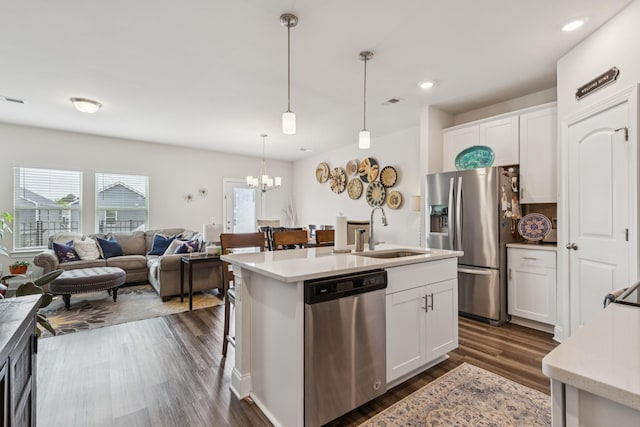 817 Arrington Way, Columbia, TN 38401 - kitchen with appliances with stainless steel finishes, a chandelier, dark wood-type flooring, light countertops, and white cabinetry