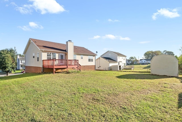 876 Gordon Pl, Clarksville, TN 37042 - back of property featuring a chimney, a deck, and a lawn