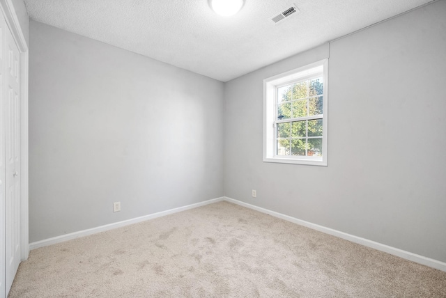 876 Gordon Pl, Clarksville, TN 37042 - carpeted spare room featuring a textured ceiling and baseboards