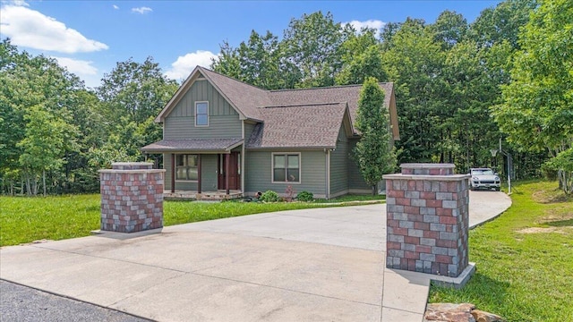 220 Bear Crawl Rd Unit Rb 28, Jasper, TN 37347 - craftsman house with board and batten siding, a front lawn, a shingled roof, and covered porch
