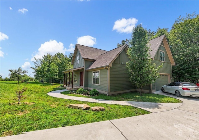 220 Bear Crawl Rd Unit Rb 28, Jasper, TN 37347 - view of home's exterior featuring a garage, board and batten siding, a lawn, concrete driveway, and roof with shingles