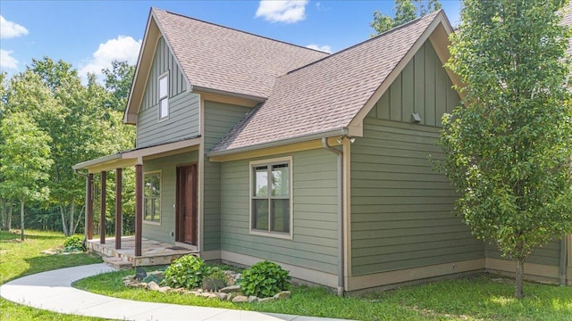 220 Bear Crawl Rd Unit Rb 28, Jasper, TN 37347 - view of property exterior with a shingled roof, board and batten siding, a lawn, and a porch