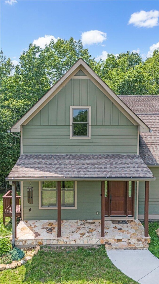220 Bear Crawl Rd Unit Rb 28, Jasper, TN 37347 - view of front of house with board and batten siding, roof with shingles, and covered porch
