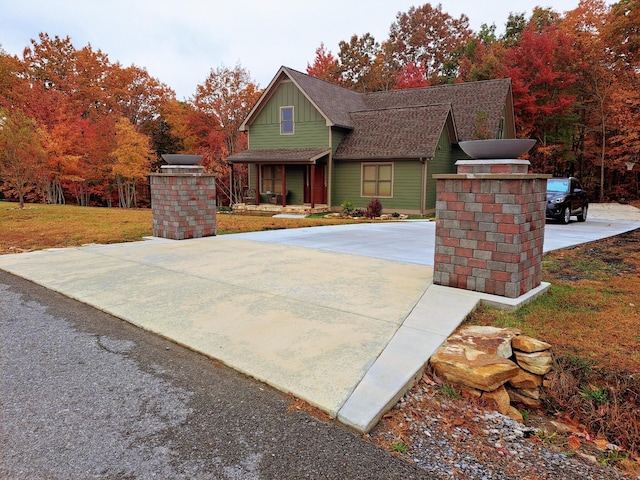220 Bear Crawl Rd Unit Rb 28, Jasper, TN 37347 - view of front of home with board and batten siding, a shingled roof, and concrete driveway
