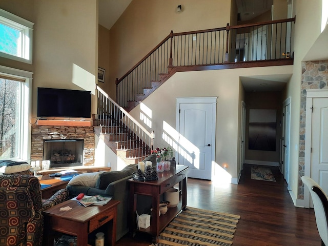 220 Bear Crawl Rd Unit Rb 28, Jasper, TN 37347 - living room featuring a towering ceiling, a stone fireplace, wood finished floors, and stairs