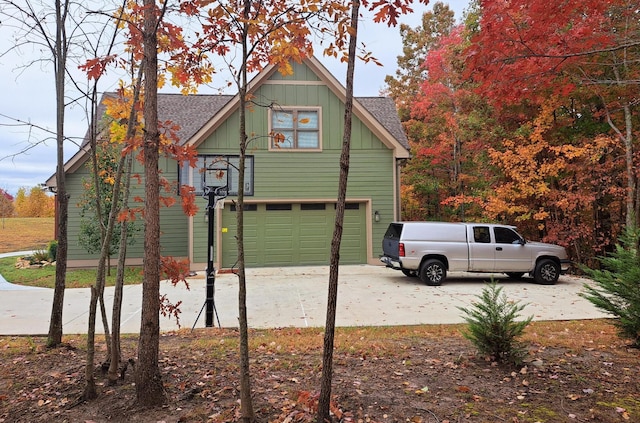 220 Bear Crawl Rd Unit Rb 28, Jasper, TN 37347 - view of property exterior with a shingled roof, driveway, a garage, and board and batten siding