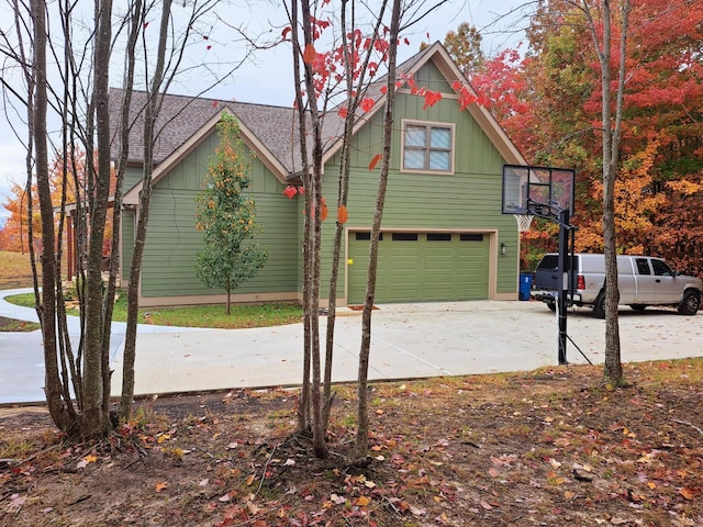 220 Bear Crawl Rd Unit Rb 28, Jasper, TN 37347 - view of property exterior with a garage, concrete driveway, and roof with shingles