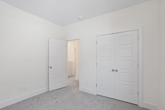 2140 18th Ave N, Nashville, TN 37208 - unfurnished bedroom featuring carpet and a closet