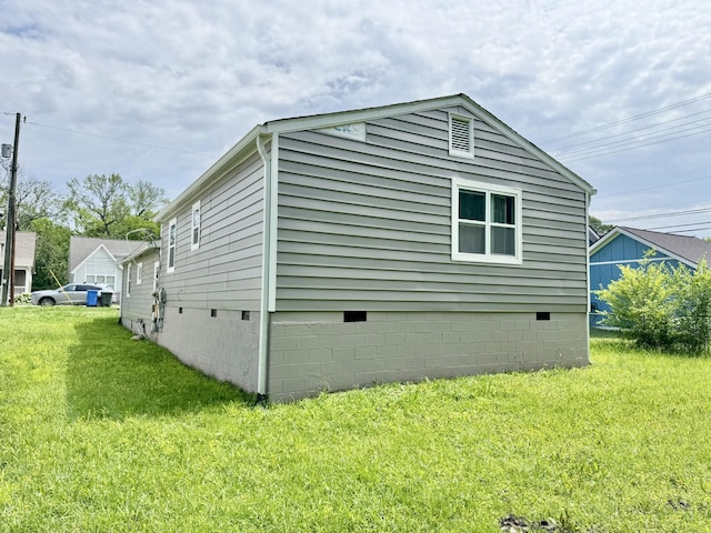 1812 13th St E, Chattanooga, TN 37404 - view of home's exterior with crawl space and a lawn