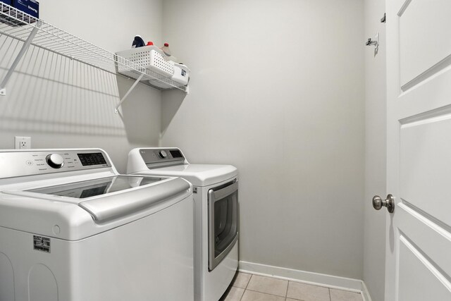 3154 Rift Ln, Murfreesboro, TN 37130 - laundry area featuring washer and clothes dryer and light tile patterned floors