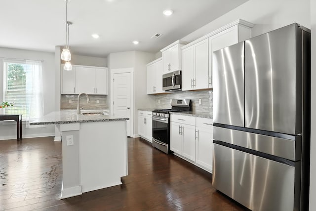 3154 Rift Ln, Murfreesboro, TN 37130 - kitchen featuring stainless steel appliances, dark wood-style floors, light stone countertops, backsplash, and recessed lighting