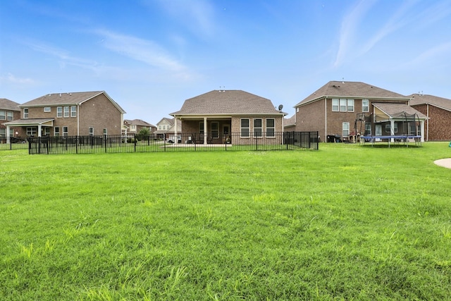 3154 Rift Ln, Murfreesboro, TN 37130 - back of house with a trampoline and a fenced backyard
