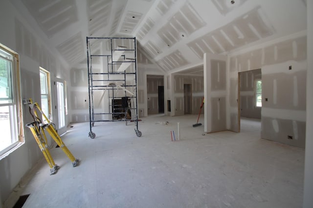 307 Brinkley Rd, Wartrace, TN 37183 - unfurnished living room featuring healthy amount of natural light and vaulted ceiling
