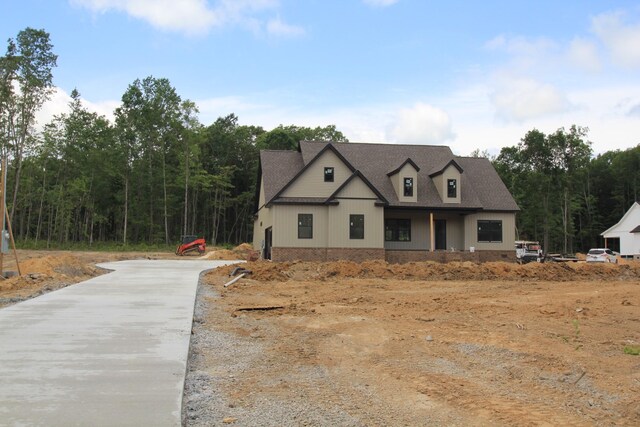 307 Brinkley Rd, Wartrace, TN 37183 - view of front of home featuring concrete driveway and roof with shingles