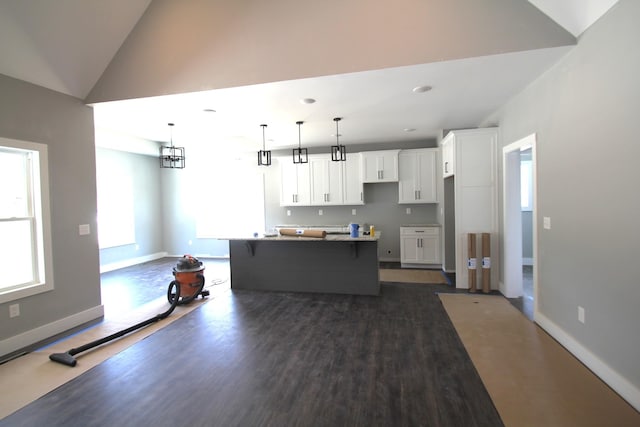333 Brinkley Rd, Wartrace, TN 37183 - kitchen with white cabinetry, healthy amount of natural light, a kitchen bar, a kitchen island, and lofted ceiling