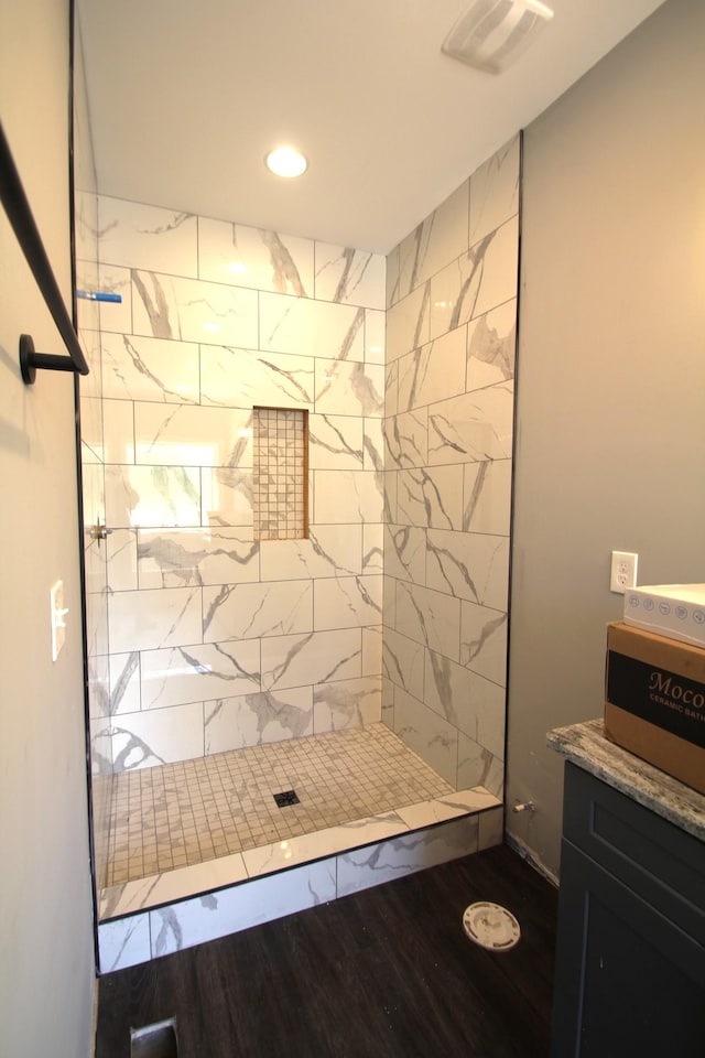 333 Brinkley Rd, Wartrace, TN 37183 - full bathroom featuring a tile shower, wood finished floors, recessed lighting, and vanity
