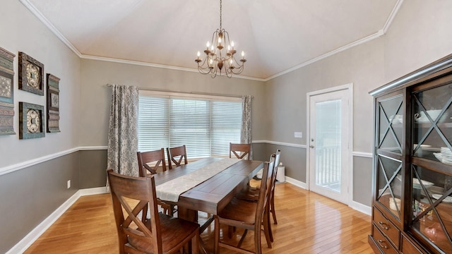 203 Ha Le Koa Ct, Smyrna, TN 37167 - dining space featuring light wood-type flooring, a chandelier, ornamental molding, and vaulted ceiling