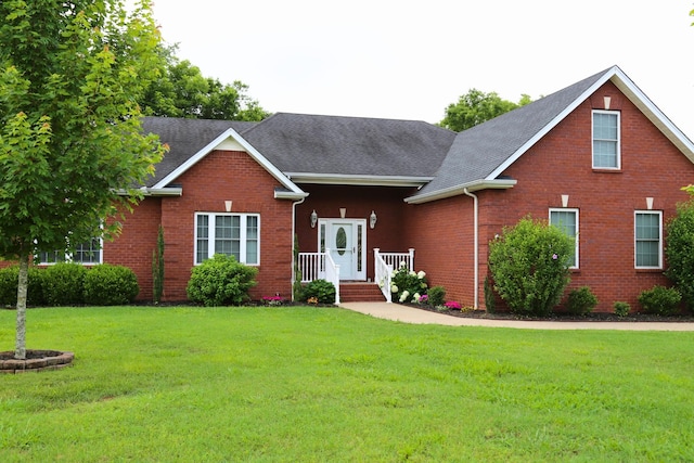 203 Ha Le Koa Ct, Smyrna, TN 37167 - traditional home featuring a front lawn, brick siding, and roof with shingles