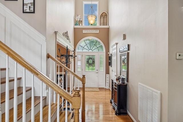 1011 Brixworth Dr, Thompsons Station, TN 37179 - foyer with a high ceiling, light wood-type flooring, and stairs