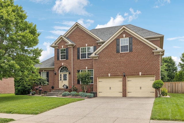 1011 Brixworth Dr, Thompsons Station, TN 37179 - view of front of property with driveway, roof with shingles, an attached garage, and brick siding