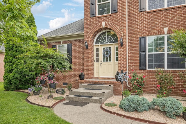 1011 Brixworth Dr, Thompsons Station, TN 37179 - doorway to property with brick siding and a shingled roof