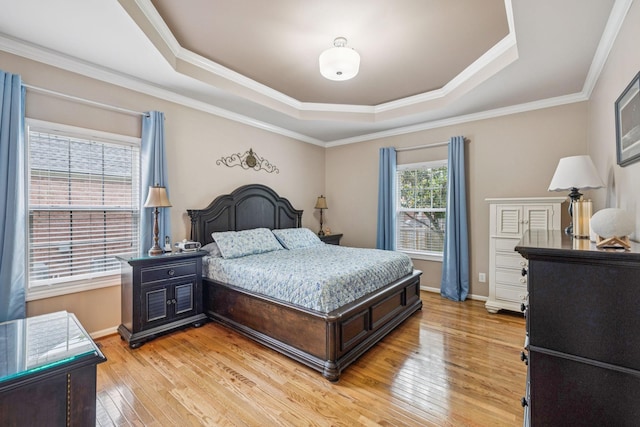 1011 Brixworth Dr, Thompsons Station, TN 37179 - bedroom with a tray ceiling, light wood-style floors, and ornamental molding