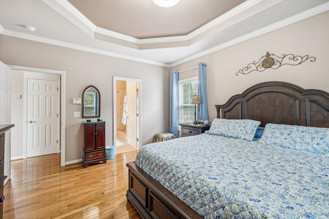 1011 Brixworth Dr, Thompsons Station, TN 37179 - bedroom with a raised ceiling, light wood-style floors, ornamental molding, and ensuite bath