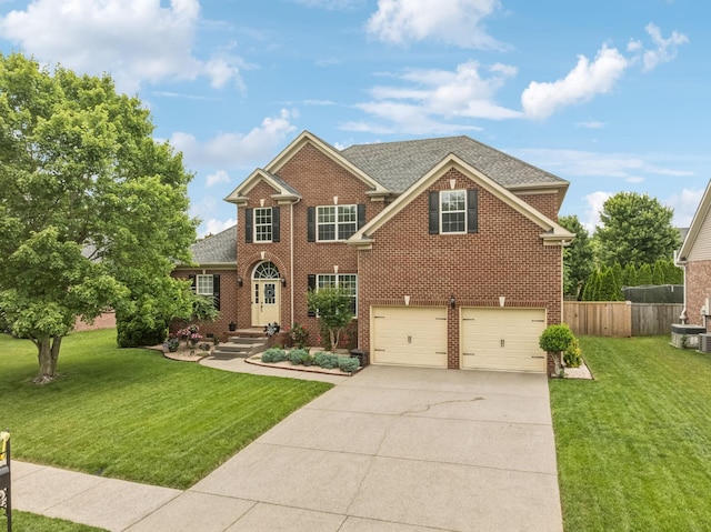 1011 Brixworth Dr, Thompsons Station, TN 37179 - view of front of home featuring an attached garage, driveway, brick siding, and roof with shingles