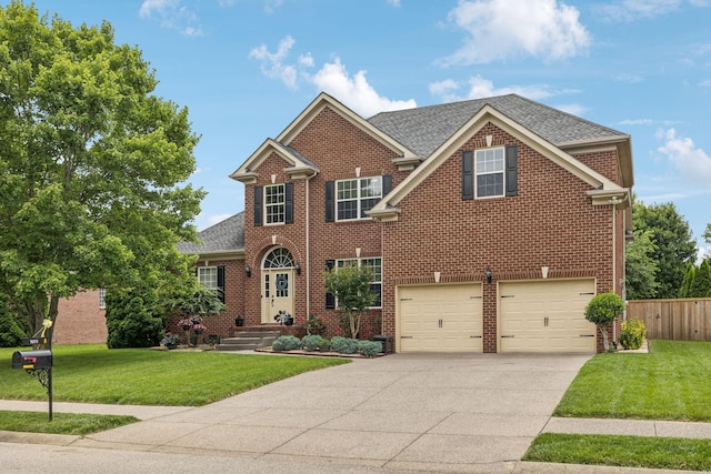 1011 Brixworth Dr, Thompsons Station, TN 37179 - view of front of house featuring concrete driveway, brick siding, an attached garage, and roof with shingles