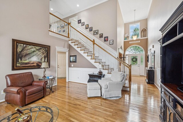 1011 Brixworth Dr, Thompsons Station, TN 37179 - entrance foyer with stairway, a towering ceiling, and light wood-style floors