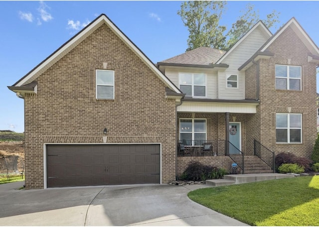 718 Excalibur Ct, Smyrna, TN 37167 - view of front facade featuring an attached garage, concrete driveway, and brick siding