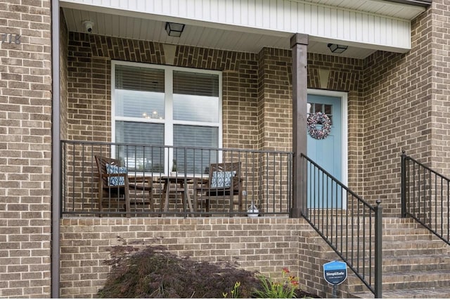 718 Excalibur Ct, Smyrna, TN 37167 - view of exterior entry with brick siding and a security system