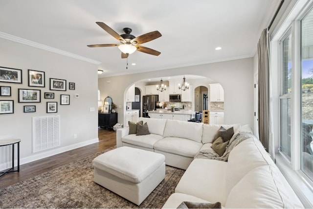 718 Excalibur Ct, Smyrna, TN 37167 - living area featuring arched walkways, a chandelier, dark wood-style flooring, ceiling fan, and recessed lighting
