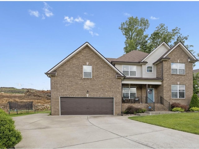 718 Excalibur Ct, Smyrna, TN 37167 - view of front of home with a garage, driveway, brick siding, and a front yard