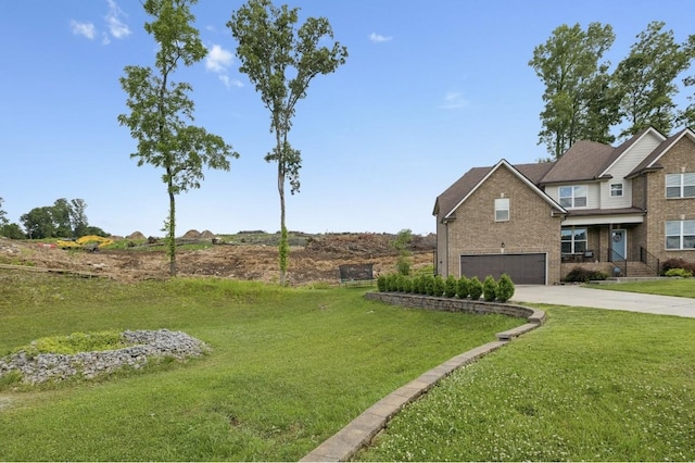 718 Excalibur Ct, Smyrna, TN 37167 - view of grassy yard with concrete driveway and an attached garage