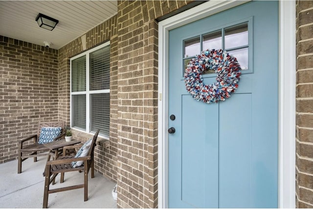 718 Excalibur Ct, Smyrna, TN 37167 - view of exterior entry with brick siding and a porch