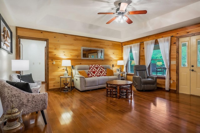 3121 Coon Hunter Lodge Rd, Jamestown, TN 38556 - living area with wood walls, ceiling fan, hardwood / wood-style flooring, and a raised ceiling