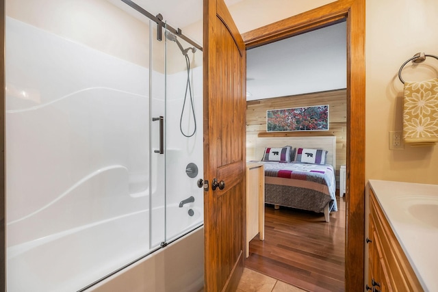 3121 Coon Hunter Lodge Rd, Jamestown, TN 38556 - full bath with enclosed tub / shower combo, vanity, wooden walls, ensuite bath, and wood finished floors