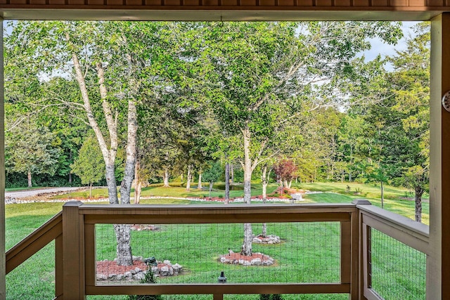 3121 Coon Hunter Lodge Rd, Jamestown, TN 38556 - wooden deck with a lawn and view of scattered trees
