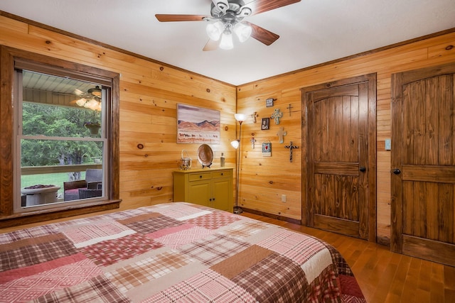 3121 Coon Hunter Lodge Rd, Jamestown, TN 38556 - bedroom featuring wood walls and hardwood / wood-style flooring