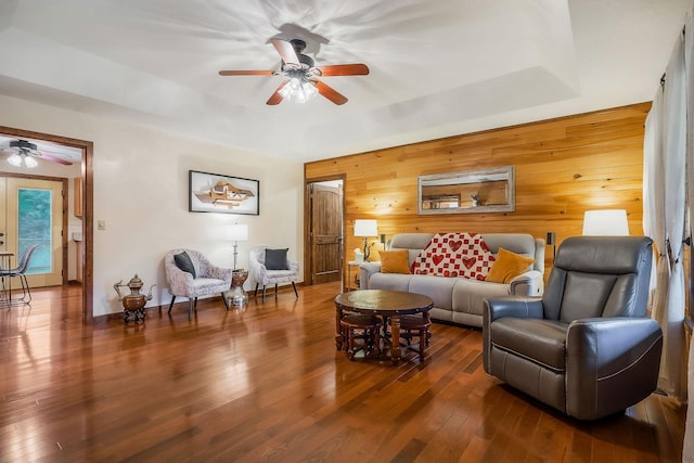 3121 Coon Hunter Lodge Rd, Jamestown, TN 38556 - living area featuring ceiling fan, hardwood / wood-style flooring, wooden walls, and a raised ceiling