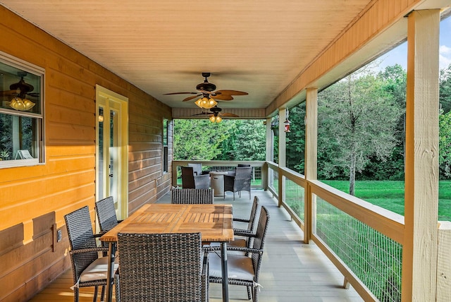 3121 Coon Hunter Lodge Rd, Jamestown, TN 38556 - deck featuring outdoor dining area, a ceiling fan, and a yard