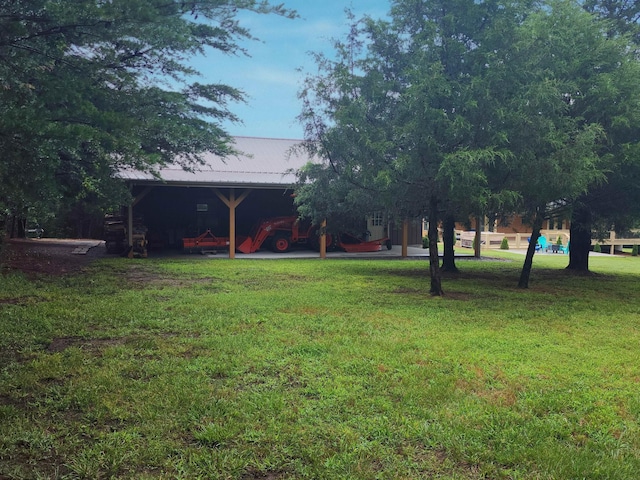3121 Coon Hunter Lodge Rd, Jamestown, TN 38556 - view of green lawn with an attached carport