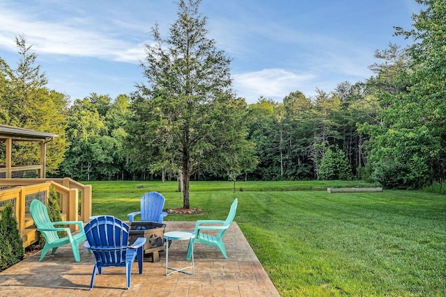 3121 Coon Hunter Lodge Rd, Jamestown, TN 38556 - view of green lawn with a fire pit and a patio