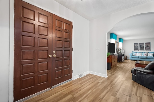 104 Chapman Dr, Lebanon, TN 37087 - entryway with arched walkways and light wood finished floors