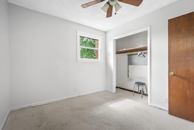 104 Chapman Dr, Lebanon, TN 37087 - unfurnished bedroom featuring carpet, a closet, a textured ceiling, and ceiling fan
