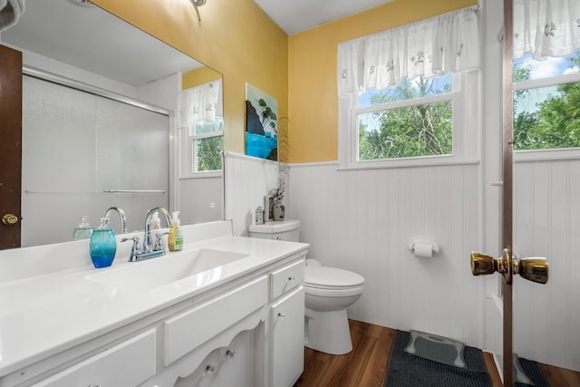 104 Chapman Dr, Lebanon, TN 37087 - full bathroom featuring vanity, wainscoting, a shower with shower door, and wood finished floors