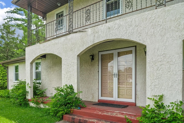 104 Chapman Dr, Lebanon, TN 37087 - property entrance with stucco siding, a balcony, and french doors