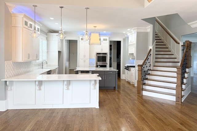 1430 Avellino Cir, Murfreesboro, TN 37130 - kitchen with a peninsula, stainless steel appliances, tasteful backsplash, recessed lighting, and glass insert cabinets