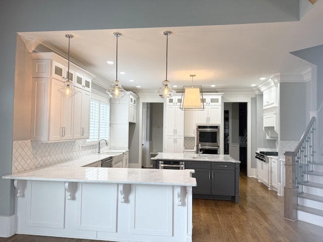 1430 Avellino Cir, Murfreesboro, TN 37130 - kitchen with a peninsula, decorative backsplash, stainless steel appliances, a kitchen island, and recessed lighting